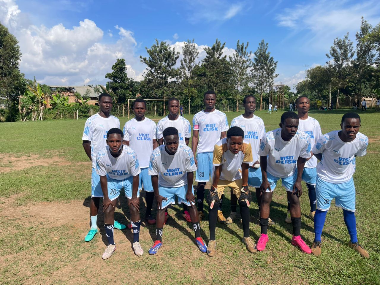 Full team squad photo in white and blue kit before kickoff