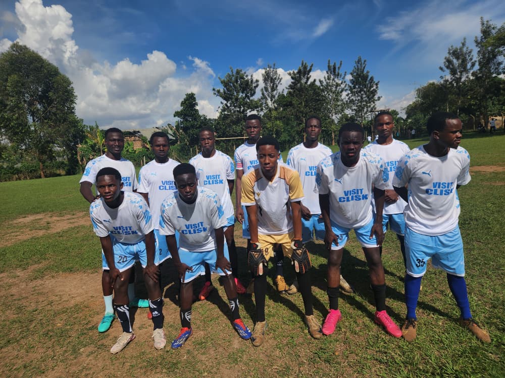 Team line-up on the pitch with Akram Bulega in goalkeeper kit